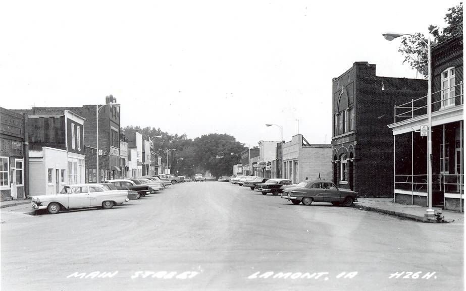 Lamont0001 old black and white image of main st lined with cars