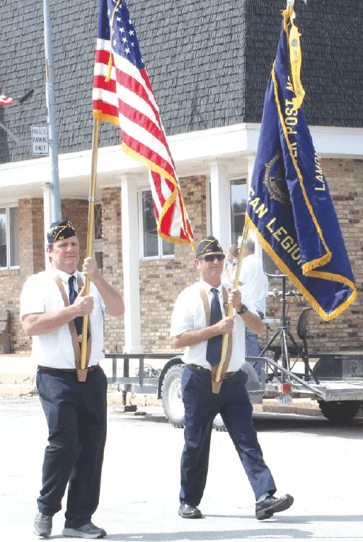 Screenshot 2021-08-31 111826 two american legion members walking in the parade